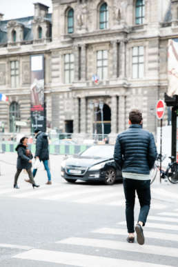 Photo of a man walking the streets of Paris, France