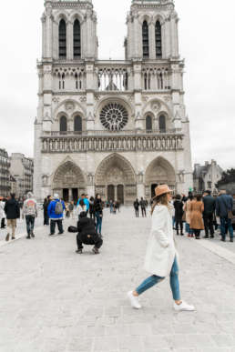 Photo of Stephanie Tusler in front of the Notre Dame in Paris, France